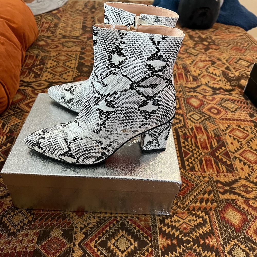 Faux snakeskin ankle boots.